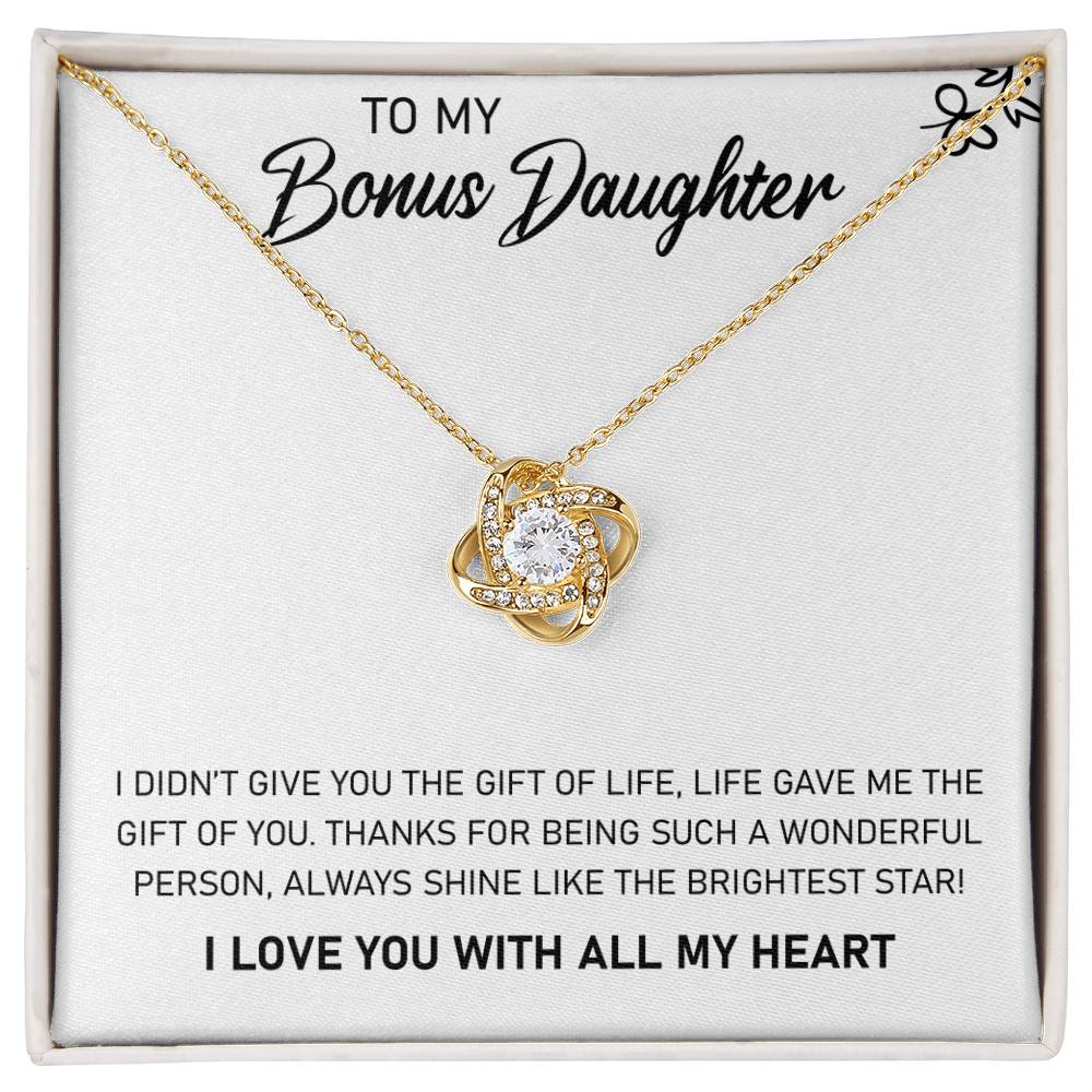A To My Bonus Daughter, Always Shine Like The Brightest Star - Love Knot Necklace gift box with a pendant that says to my bonus daughter, adorned with cubic zirconia crystals by ShineOn Fulfillment.