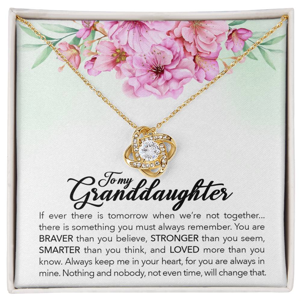 This elegant ShineOn Fulfillment Love Knot Necklace features a gift box with a delicate pendant that says "granddaughter". The necklace is adorned with sparkling cubic zirconia crystals and comes with an adjustable chain length for.