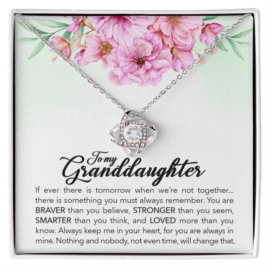 An exquisite gift box featuring a stunning "To My Granddaughter, Always Keep Me In Your Heart" Love Knot Necklace by ShineOn Fulfillment for granddaughters. This beautiful necklace offers an adjustable chain length and is adorned with sparkling cubic zirconia crystals.