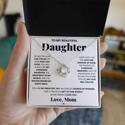 Surprise your special mom with a meaningful gift box featuring an exquisite My Cherished Daughter - Love Knot Necklace from ShineOn Fulfillment, symbolizing the unbreakable bond between a mother and daughter. The necklace elegantly displays the heartfelt message.