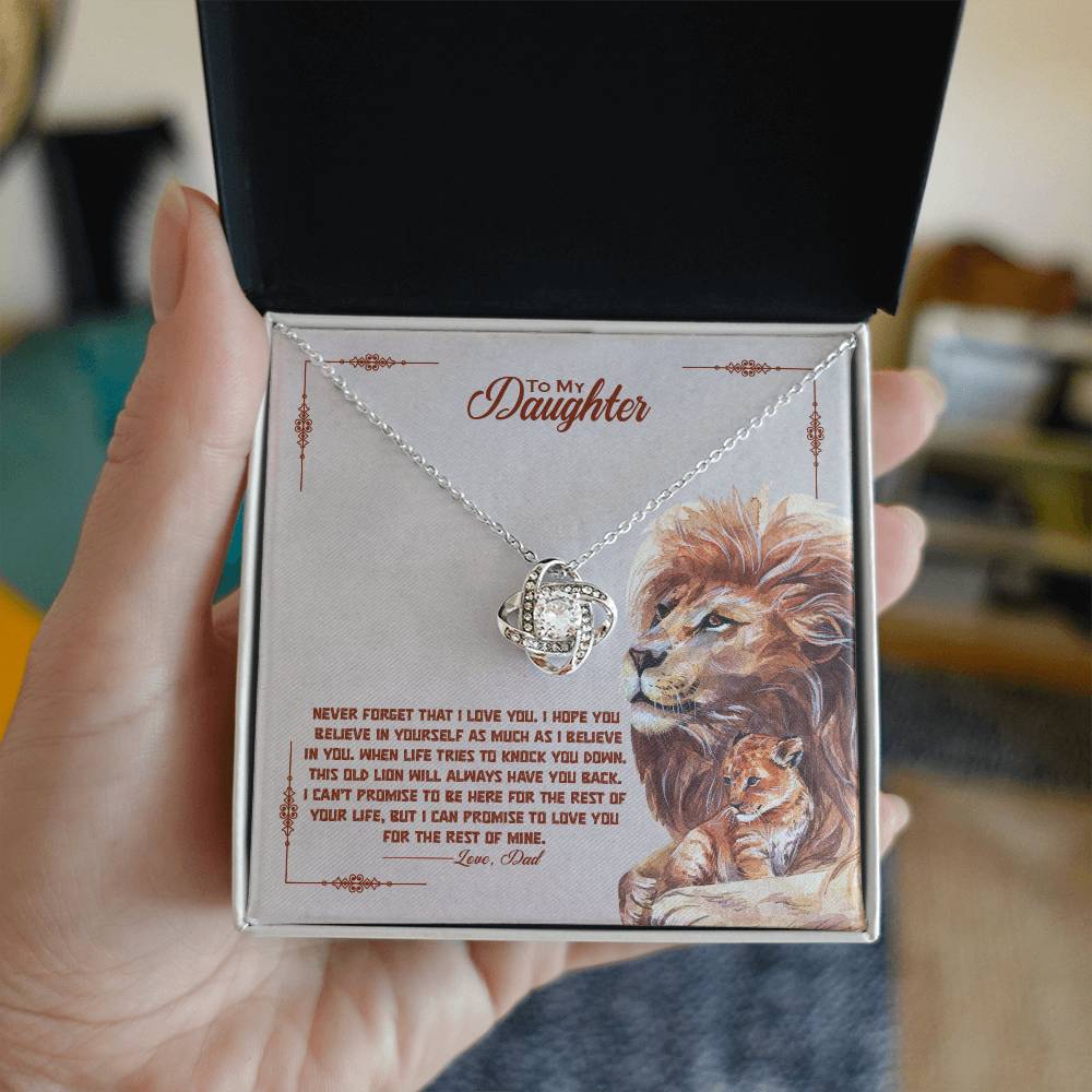 A gift box with a To My Beautiful Daughter, I Promise To Love You For The Rest Of My Life - Love Knot Necklace pendant by ShineOn Fulfillment and cubic zirconia crystals surrounding it.