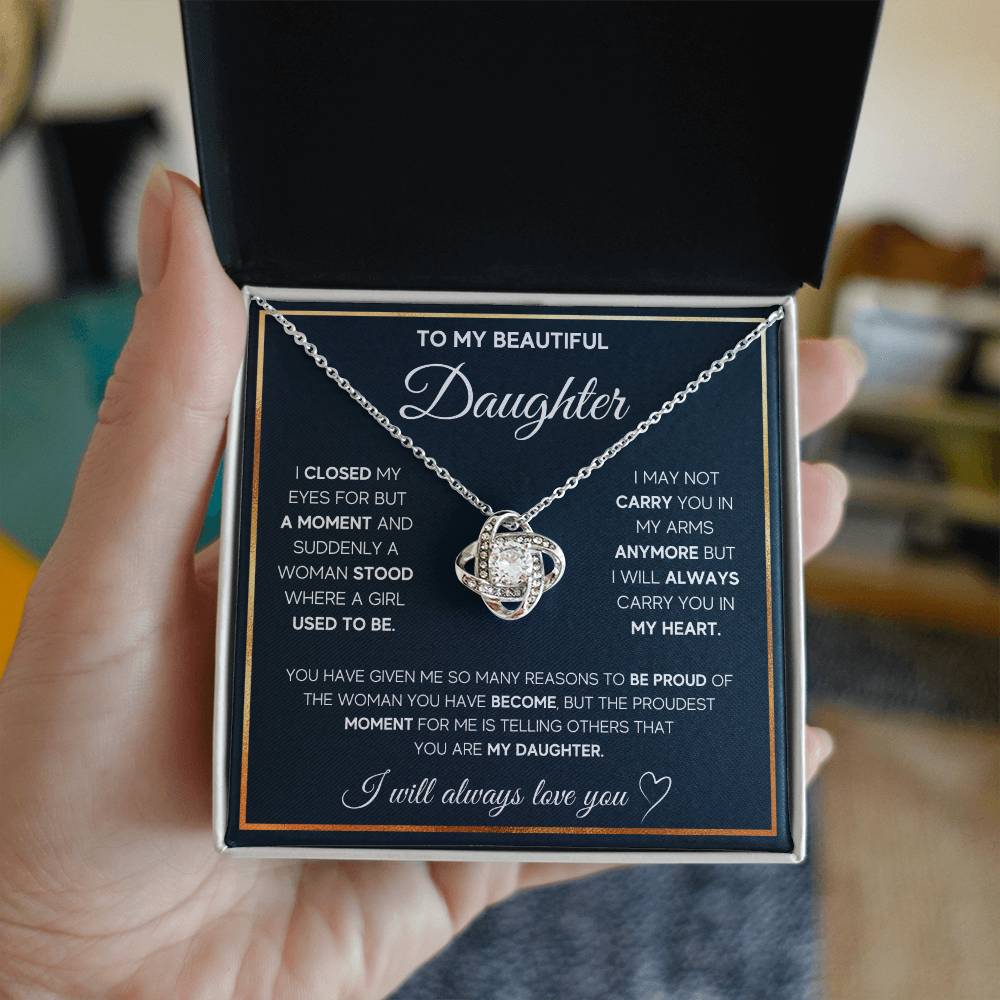 A beautiful To My Daughter, I Will Always Carry You In My Heart - Love Knot Necklace pendant in a gift box, adorned with cubic zirconia crystals, dedicated to my daughter from ShineOn Fulfillment.