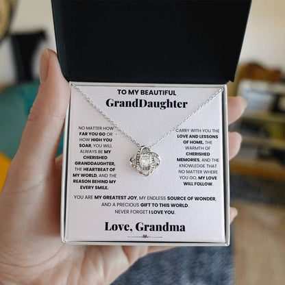 Cherished Granddaughter Grandma - Love Knot Necklace adorned with cubic zirconia crystals, featuring a beautiful Love Knot pendant to symbolize the unbreakable bond between grandmas and their granddaughters, by ShineOn Fulfillment.