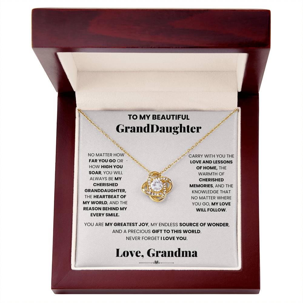 A Cherished Granddaughter Grandma - Love Knot Necklace by ShineOn Fulfillment, embellished with cubic zirconia crystals, presented in a charming wooden box. The perfect gift for a beloved grand daughter.