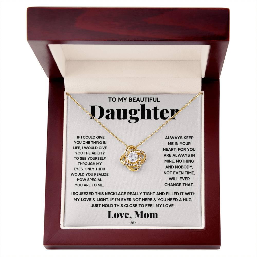 A To My Beautiful Daughter, Just Hold This To Feel My Love - Love Knot Necklace gift box with an adjustable chain length and adorned with sparkling cubic zirconia crystals, expressing heartfelt sentiments to a beloved daughter from ShineOn Fulfillment.