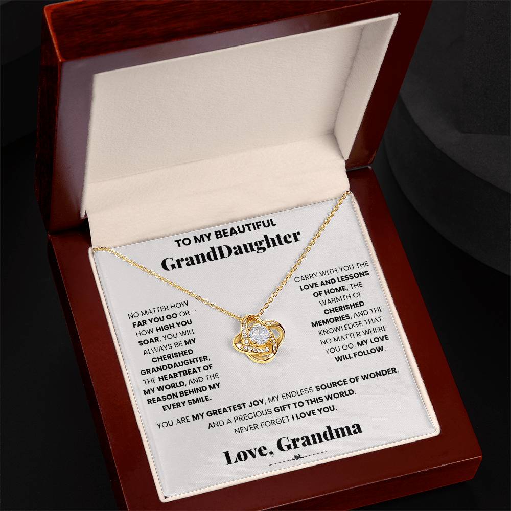 A gift box with a Cherished Granddaughter Grandma - Love Knot Necklace, adorned with cubic zirconia crystals, that says love grandma by ShineOn Fulfillment.