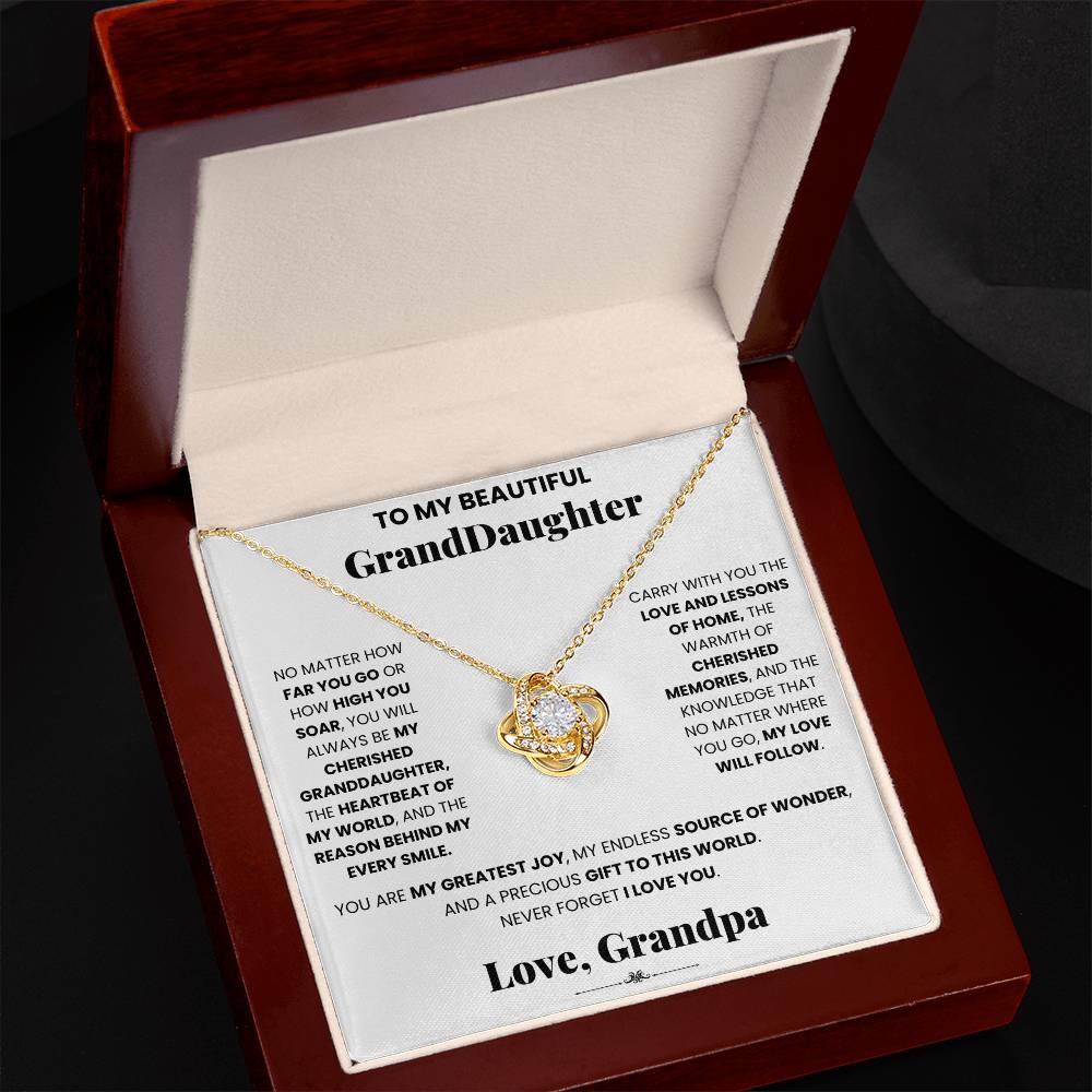 A Cherished Granddaughter Grandpa - Love Knot Necklace, adorned with cubic zirconia crystals, delicately nestled in a wooden box by ShineOn Fulfillment.