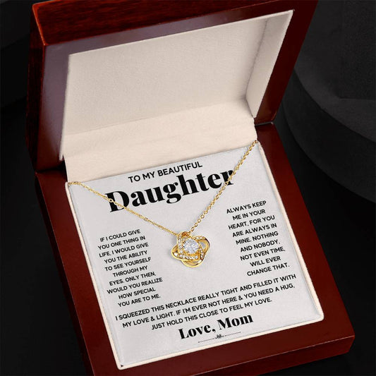 This elegant To My Beautiful Daughter, Just Hold This To Feel My Love - Love Knot Necklace by ShineOn Fulfillment features a delicate adjustable chain length and is adorned with shimmering cubic zirconia crystals. Presented in a stylish box, it makes the perfect gift for any occasion.