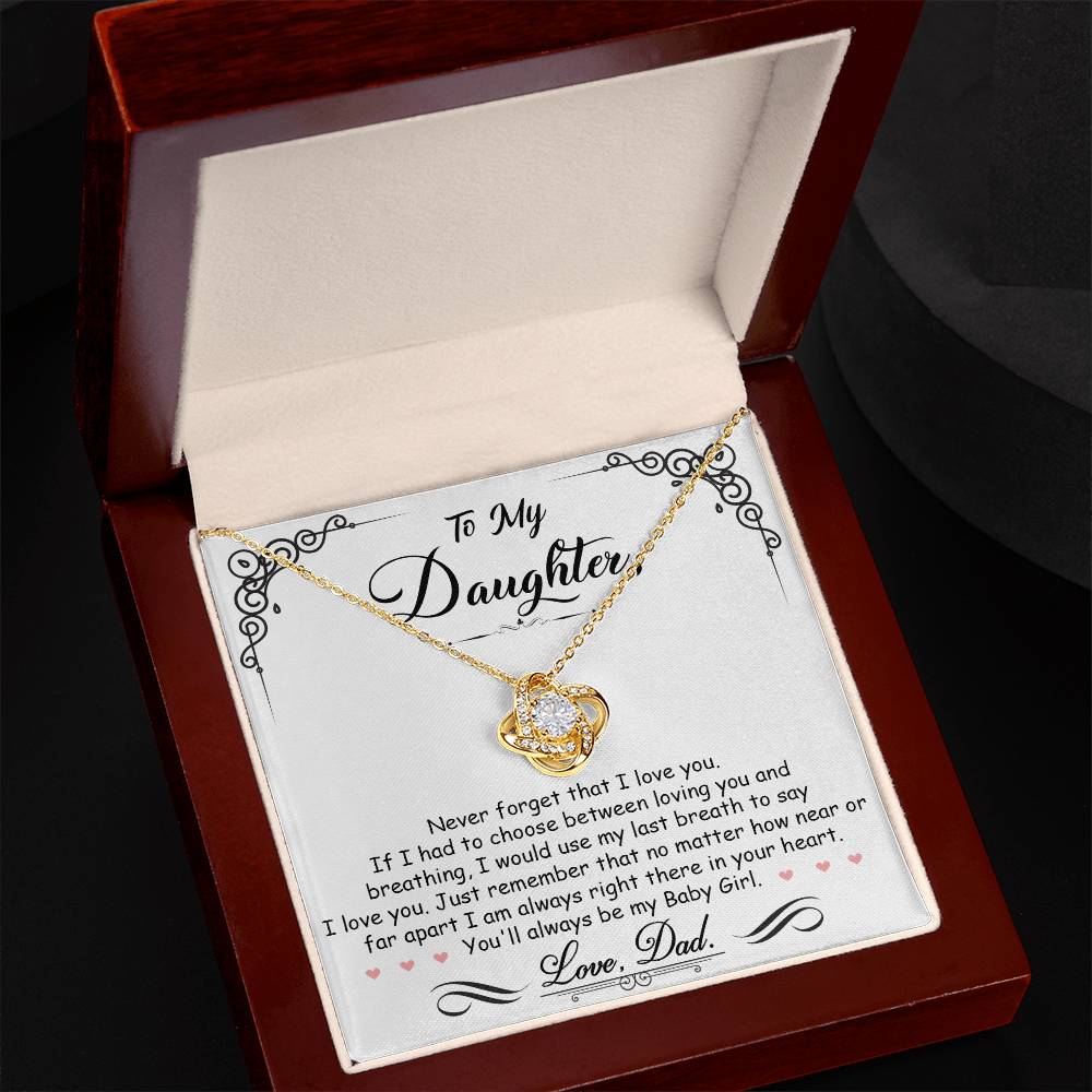 A To My Daughter, I'm Always Right Here In Your Heart - Love Knot Necklace pendant, adorned with cubic zirconia crystals, beautifully presented in a ShineOn Fulfillment gift box.