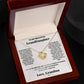 An adjustable chain length box with a Love forever grandma - Love Knot Necklace inside, embellished with Cubic Zirconia Crystals, conveying the message "love grandma", by ShineOn Fulfillment.