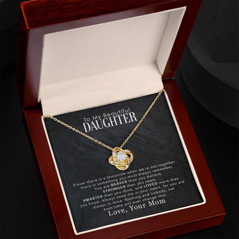 A To My Beautiful Daughter, You Are Braver Than You Believe - Love Knot Necklace with cubic zirconia crystals, elegantly presented in a gift box by ShineOn Fulfillment.