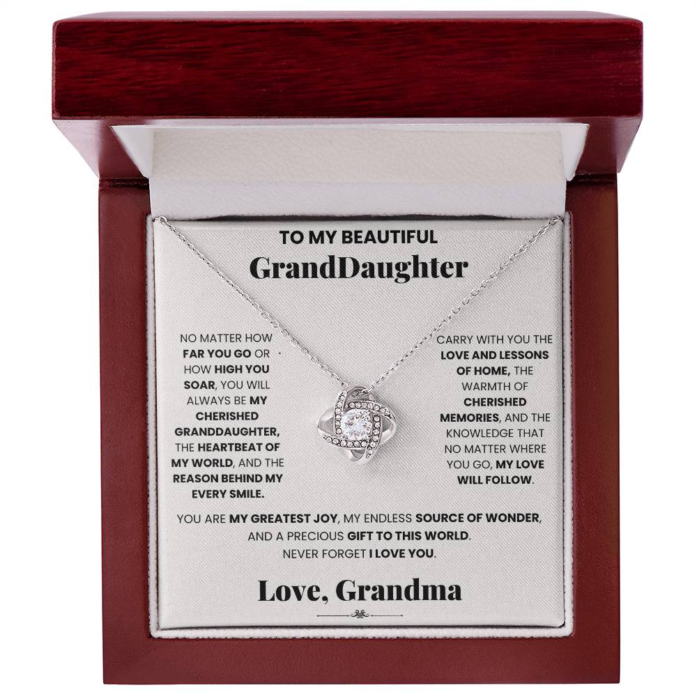 A Cherished Granddaughter Grandma - Love Knot Necklace with a pendant engraved with the words to my beautiful granddaughter, by ShineOn Fulfillment.