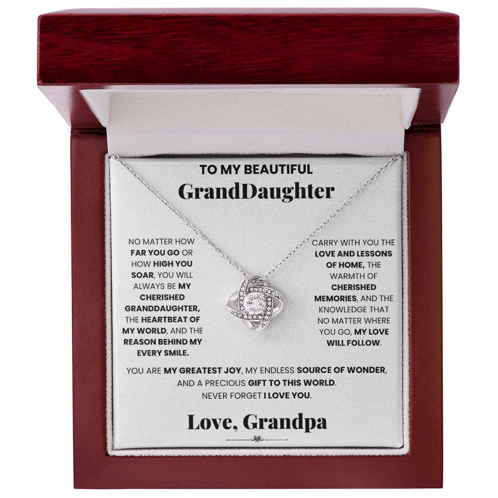 A beautiful Cherished Granddaughter Grandpa - Love Knot Necklace pendant, adorned with sparkling cubic zirconia crystals, especially designed for your granddaughter by ShineOn Fulfillment.
