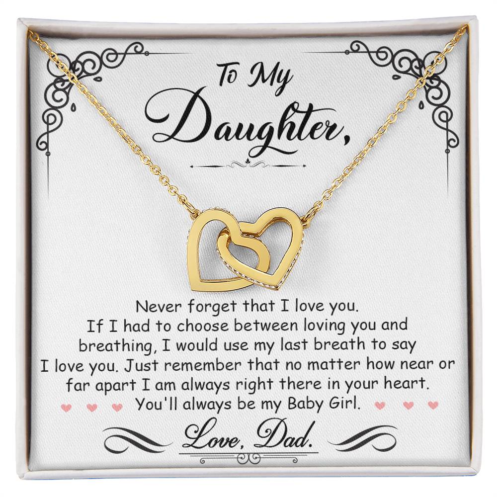 A heartfelt gift box with a "To My Daughter, I'm Always Right Here In Your Heart - Interlocking Hearts Necklace" adorned with love and hearts, engraved with the words "To Dad, My Daughter," made by ShineOn Fulfillment.