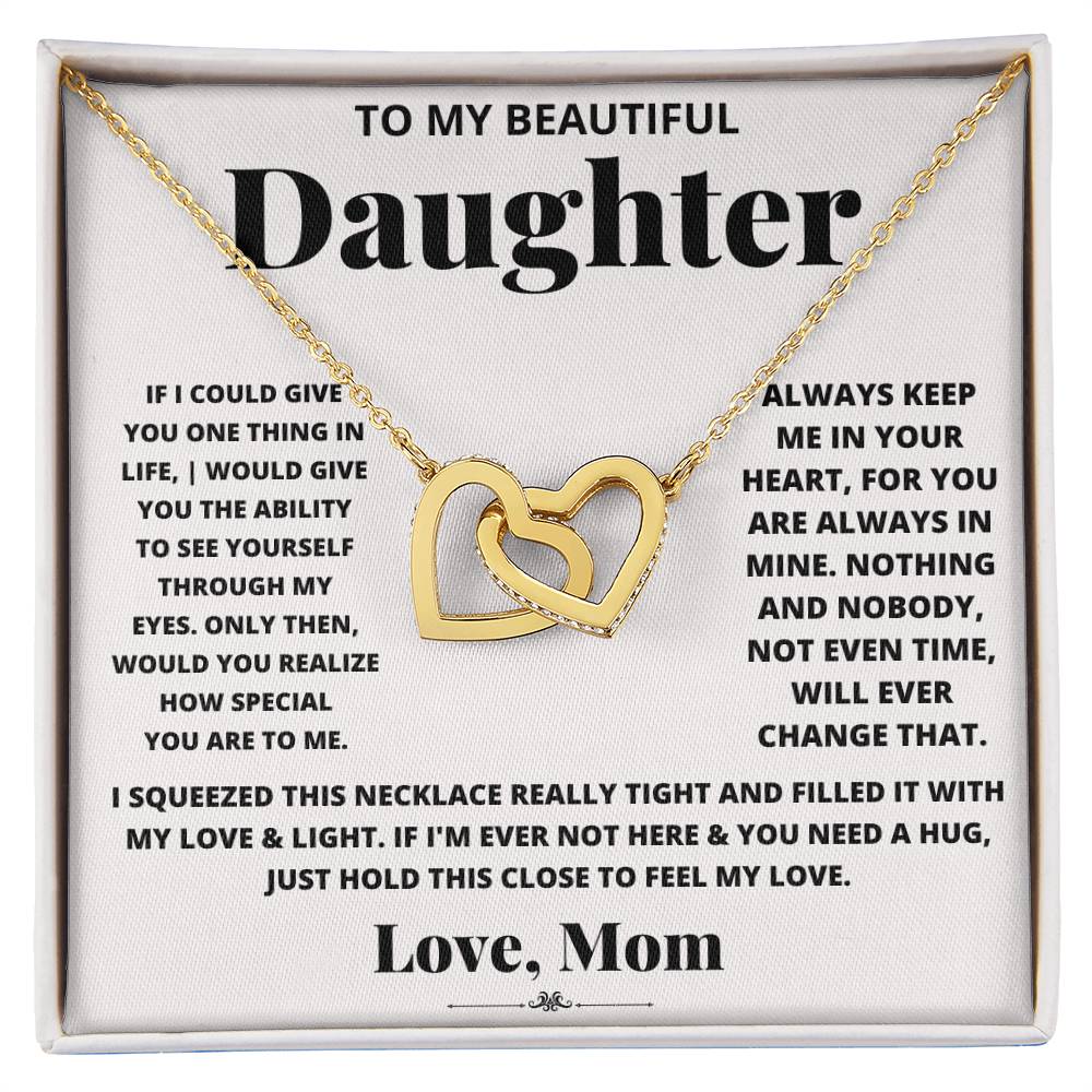 A box with an I Squeezed This Necklace Really Tight - Interlocking Hearts necklace, adorned with cubic zirconia crystals, that says "to my beautiful daughter" by ShineOn Fulfillment.