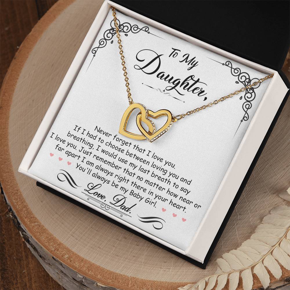 A heartfelt To My Daughter, I_m Always Right Here In Your Heart - Interlocking Hearts Necklace by ShineOn Fulfillment expressing love for my daughter, adorned with a single golden heart.
