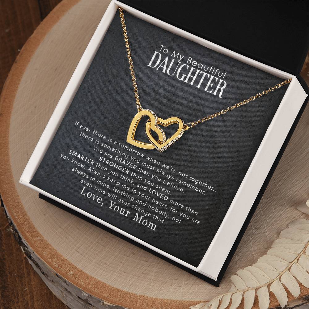 Surprise your daughter with a stunning gift box containing the "To My Beautiful Daughter, You Are Braver Than You Believe - Interlocking Hearts Necklace" adorned with shimmering cubic zirconia crystals by ShineOn Fulfillment.