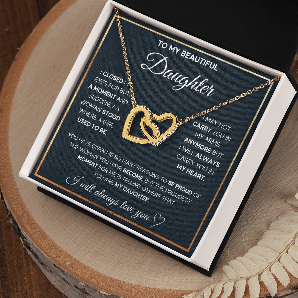 A "To My Daughter, I Will Always Carry You In My Heart - Interlocking Hearts Necklace" by ShineOn Fulfillment adorned with cubic zirconia crystals, making it a perfect gift for your special someone.