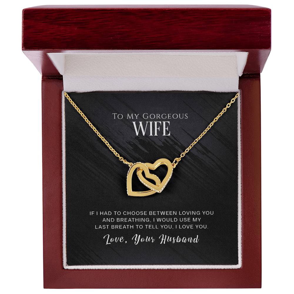 An exquisite "To My Wife, I Love You - Interlocking Hearts Necklace" from ShineOn Fulfillment, featuring cubic zirconia crystals, carefully enclosed in a beautifully crafted wooden box, making it the perfect sentimental gift for your special someone.