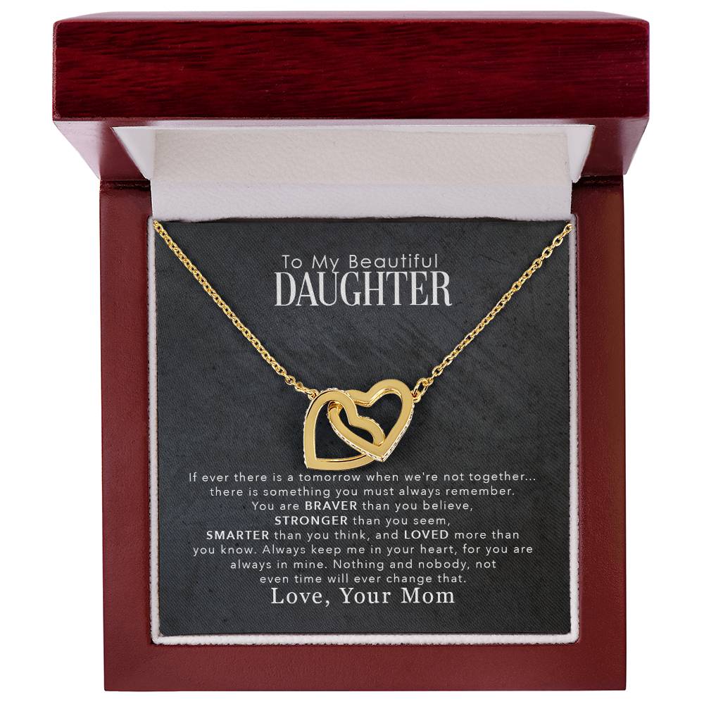 A gift box with the To My Beautiful Daughter, You Are Braver Than You Believe - Interlocking Hearts Necklace by ShineOn Fulfillment.