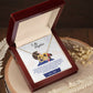 A gift box with the "To My Daughter, You_ll Always Be My Baby Girl - Interlocking Hearts Necklace" adorned with cubic zirconia crystals and a heartfelt poem on it, from ShineOn Fulfillment.