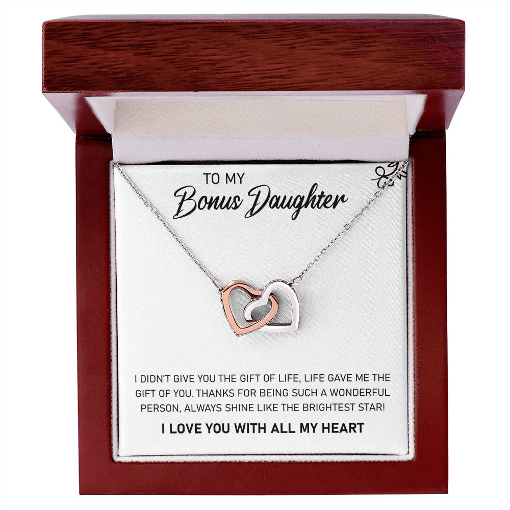 A love-themed gift box, containing the To My Bonus Daughter, Always Shine Like The Brightest Star - Interlocking Hearts Necklace by ShineOn Fulfillment.