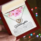 A person holding a gift box with a ShineOn Fulfillment - Interlocking Hearts Necklace inside.