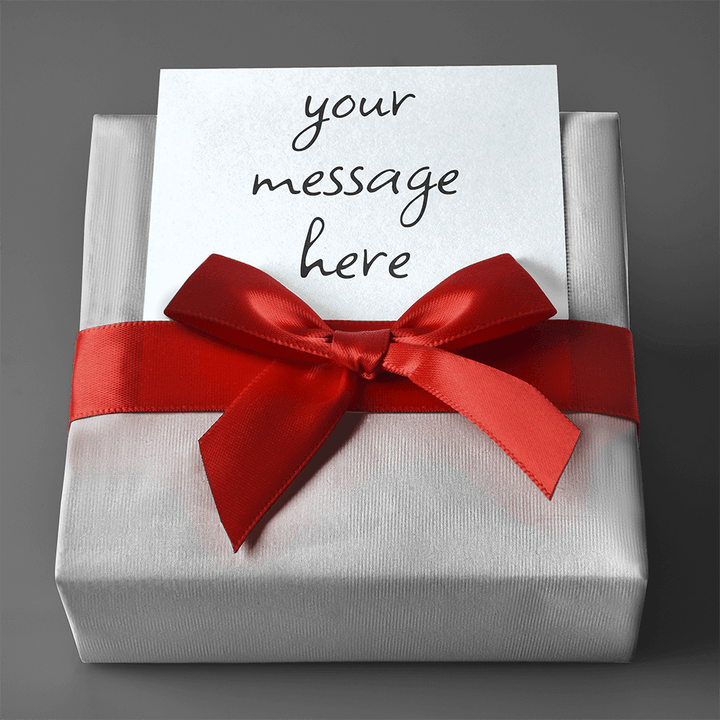 A ShineOn Fulfillment personalized gift box with a red ribbon and a note inside.