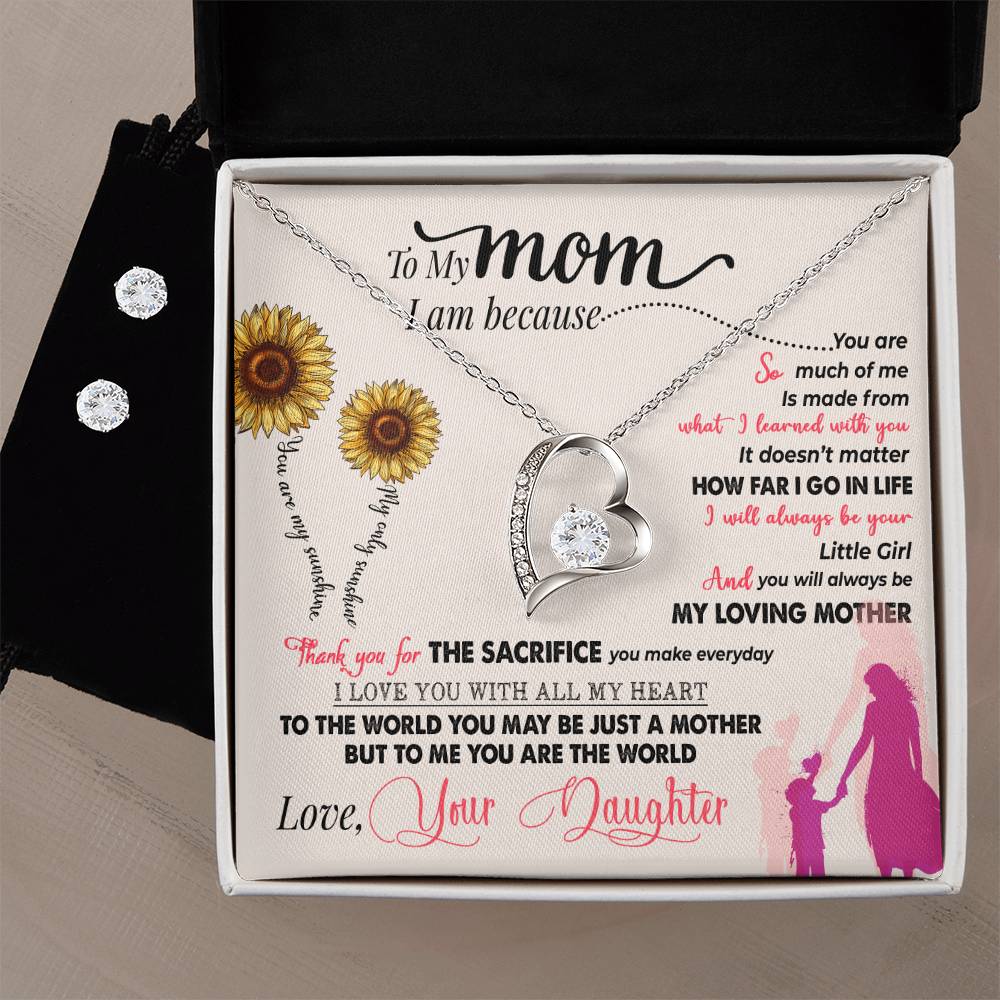 The To My Mom, Thank You For Everything - Forever Love Necklace by ShineOn Fulfillment glistens in its gift box with a stunning silver heart shape and 14k white gold finish. Accompanied by a Cubic Zirconia Earring Set, the gift box's interior features a heartfelt message to Mom surrounded by sunflowers and silhouettes of a mother and daughter holding hands.