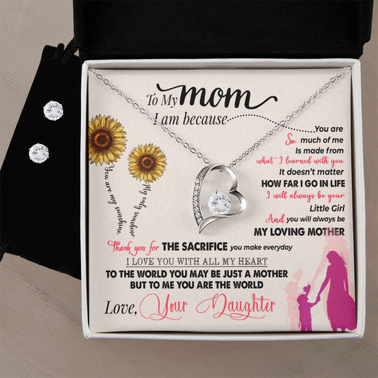 The To My Mom, Thank You For Everything - Forever Love Necklace by ShineOn Fulfillment glistens in its gift box with a stunning silver heart shape and 14k white gold finish. Accompanied by a Cubic Zirconia Earring Set, the gift box's interior features a heartfelt message to Mom surrounded by sunflowers and silhouettes of a mother and daughter holding hands.