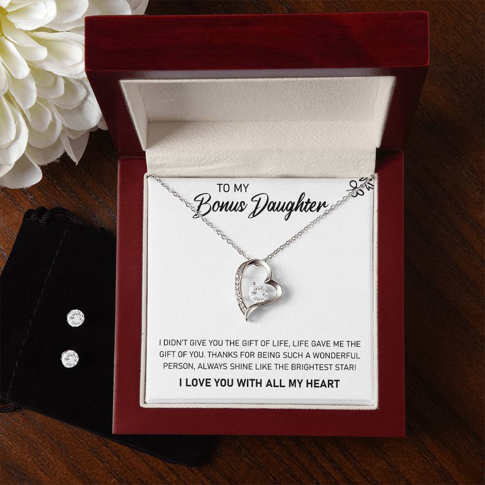 This sparkling gift box contains a To My Bonus Daughter, Always Shine Like The Brightest Star - Forever Love Necklace, featuring a stunning heart-shaped pendant.