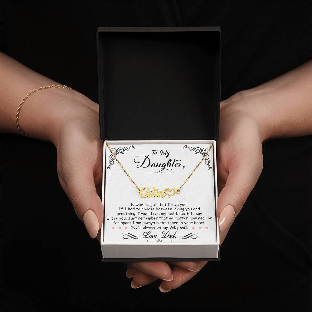 A woman holding a personalized gift box with a My Beautiful Daughter - Name Necklace with Heart by ShineOn Fulfillment in it.