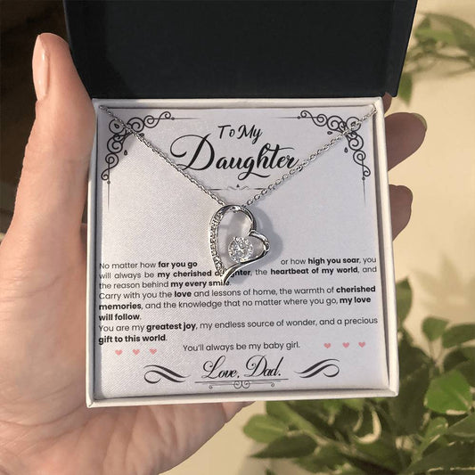 A hand holding a gift box with the My Cherished Daughter - Forever Love Necklace by ShineOn Fulfillment in it.