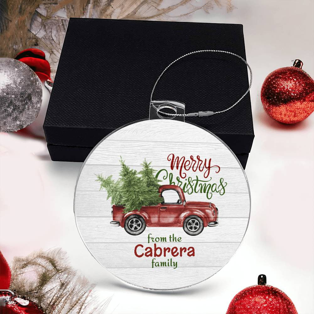 This customized Christmas ornament from AnywherePOD, featuring a vintage red truck with a tree and the message "Merry Christmas from the Cabrera family," is an acrylic creation that arrives on a black box adorned with red and silver baubles. The "Create Cherished Memories with a Personalized Family Name Christmas Ornament!" makes for an ideal holiday gift.