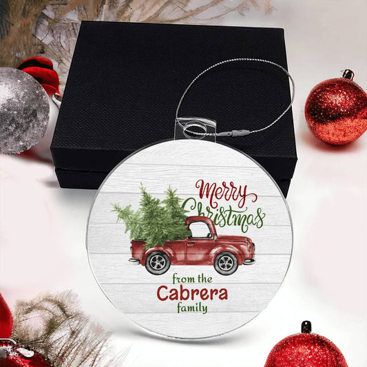 This customized Christmas ornament from AnywherePOD, featuring a vintage red truck with a tree and the message "Merry Christmas from the Cabrera family," is an acrylic creation that arrives on a black box adorned with red and silver baubles. The "Create Cherished Memories with a Personalized Family Name Christmas Ornament!" makes for an ideal holiday gift.