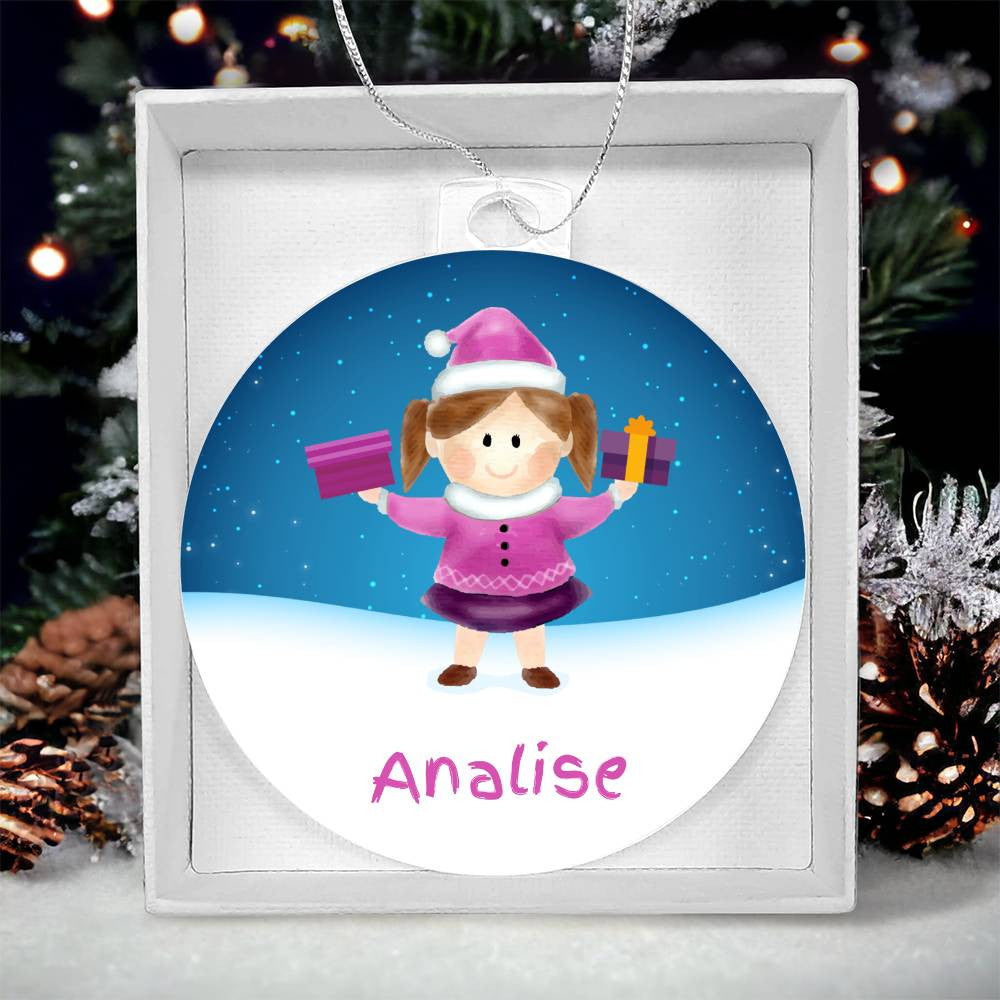 Introducing the "Brighten Her Holiday with a Custom Girls' Name Christmas Ornament" by AnywherePOD: This extraordinary keepsake features a cartoon girl named Analise dressed in a pink outfit and Santa hat, joyfully holding gifts. The ornament is set against a snow-covered scene with a beautifully decorated Christmas tree, capturing the festive spirit in perfect detail.
