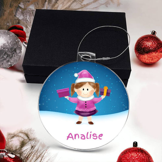 Create a lasting memory with the "Brighten Her Holiday with a Custom Girls' Name Christmas Ornament" by AnywherePOD. This special acrylic ornament features a cartoon girl in a pink outfit and Santa hat, holding two gifts, with "Analise" elegantly written at the bottom. Presented in a black box adorned with festive decorations, it perfectly embodies the holiday spirit.