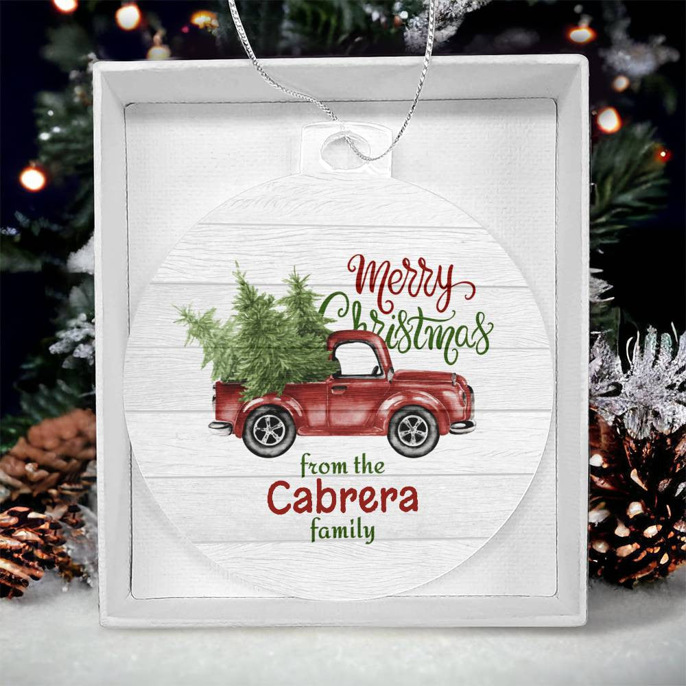 Introducing the "Create Cherished Memories with a Personalized Family Name Christmas Ornament" from AnywherePOD: This charming acrylic ornament showcases a red vintage truck carrying trees, adorned with the message "Merry Christmas from the Cabrera family." Arriving in a delightful gift box and set against a snowy tree background, it makes for the perfect custom-made gift.