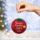 A person holding a AnywherePOD Family Name Personalized Christmas Ornament.