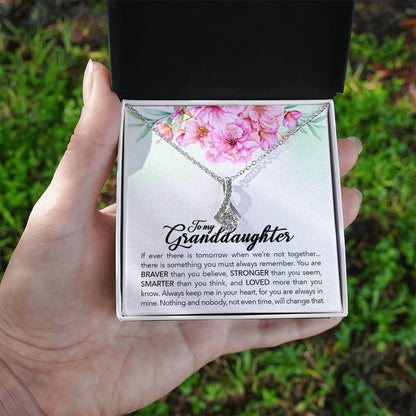 A hand delicately grasping a gift box, revealing the ShineOn Fulfillment To My Granddaughter, Always Keep Me In Your Heart, - Alluring Beauty Necklace.