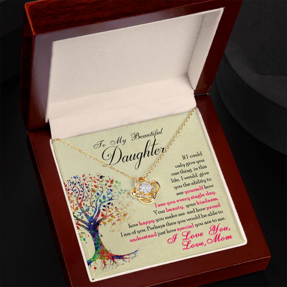 A gift box with a To My Beautiful Daughter, You Are Special To Me - Love Knot Necklace pendant from ShineOn Fulfillment.