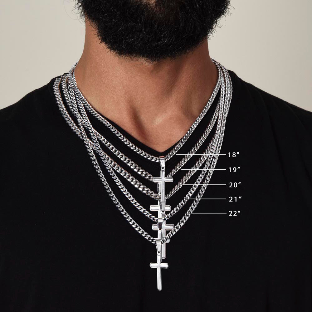 A man with a beard is wearing a necklace with the "To My Son - This Old Lion Has Your Back" cross on it, symbolizing his love for his son. The necklace is from ShineOn Fulfillment.