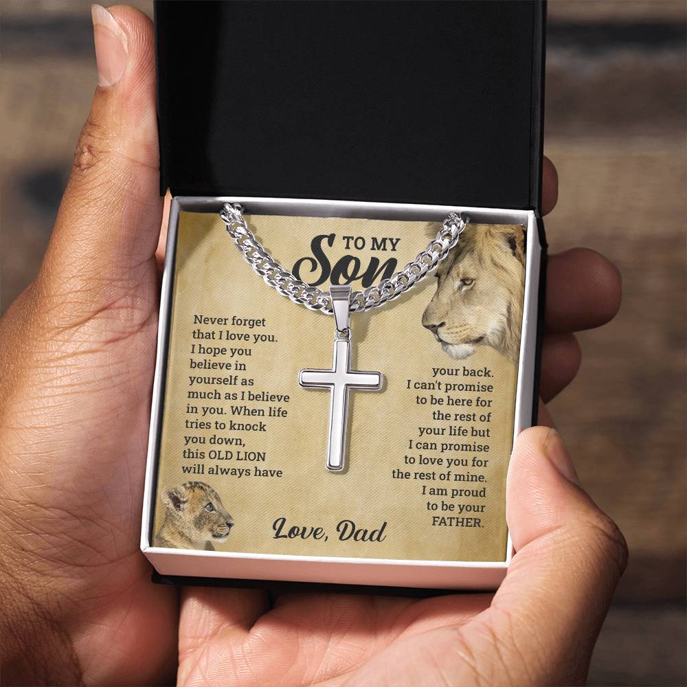 A gift box with the "To My Son - This Old Lion Has Your Back" necklace by ShineOn Fulfillment and a cross, symbolizing the love for a son.