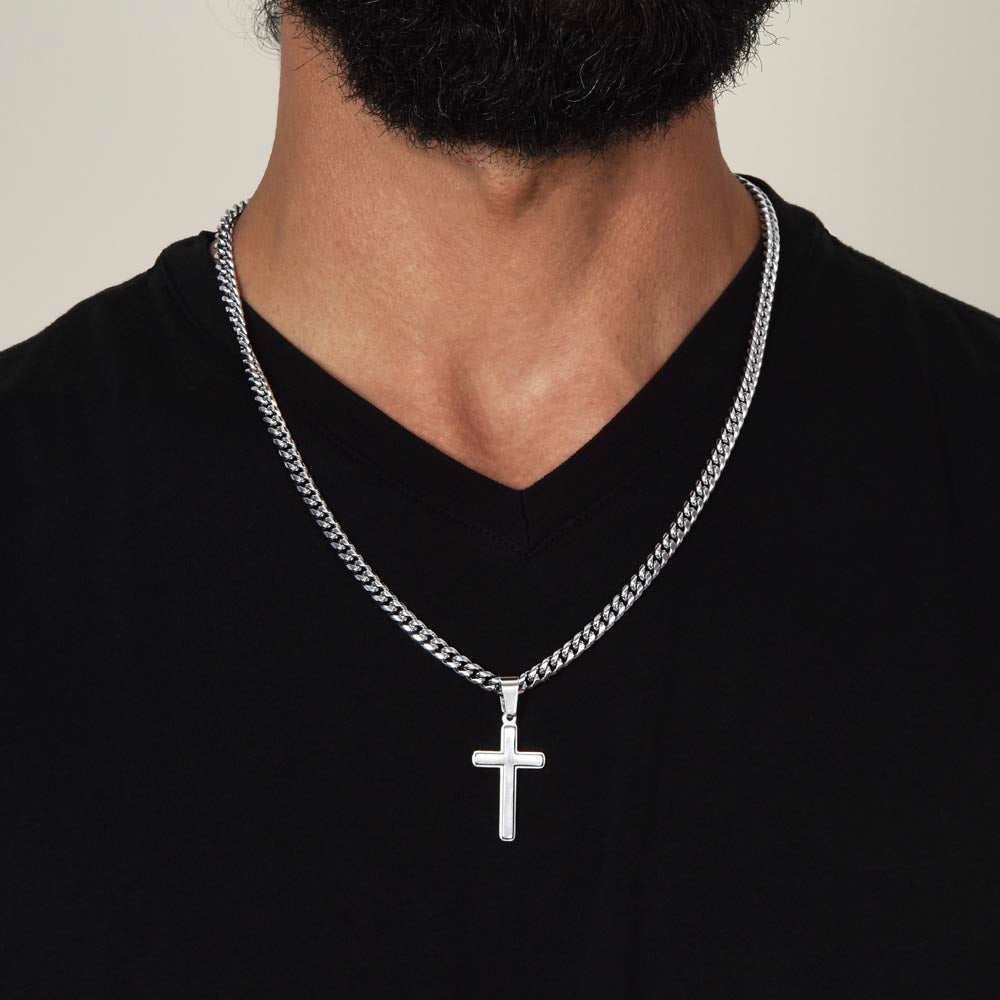 A man with a black beard wearing a cross necklace, displaying his love for his son, proudly showcases the "To My Son - This Old Lion Has Your Back" necklace from ShineOn Fulfillment.