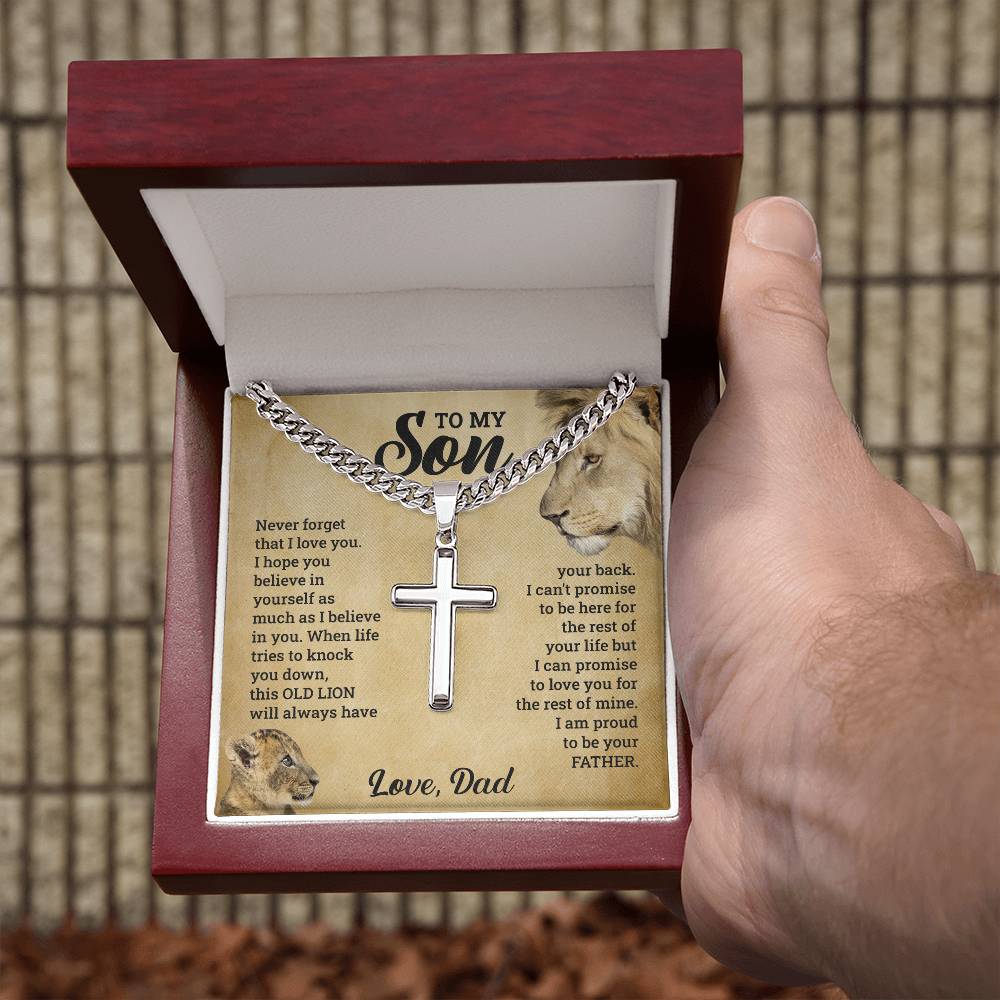 A person holding the "To My Son - This Old Lion Has Your Back" necklace inscribed with a heartfelt love poem dedicated to their beloved son by ShineOn Fulfillment.