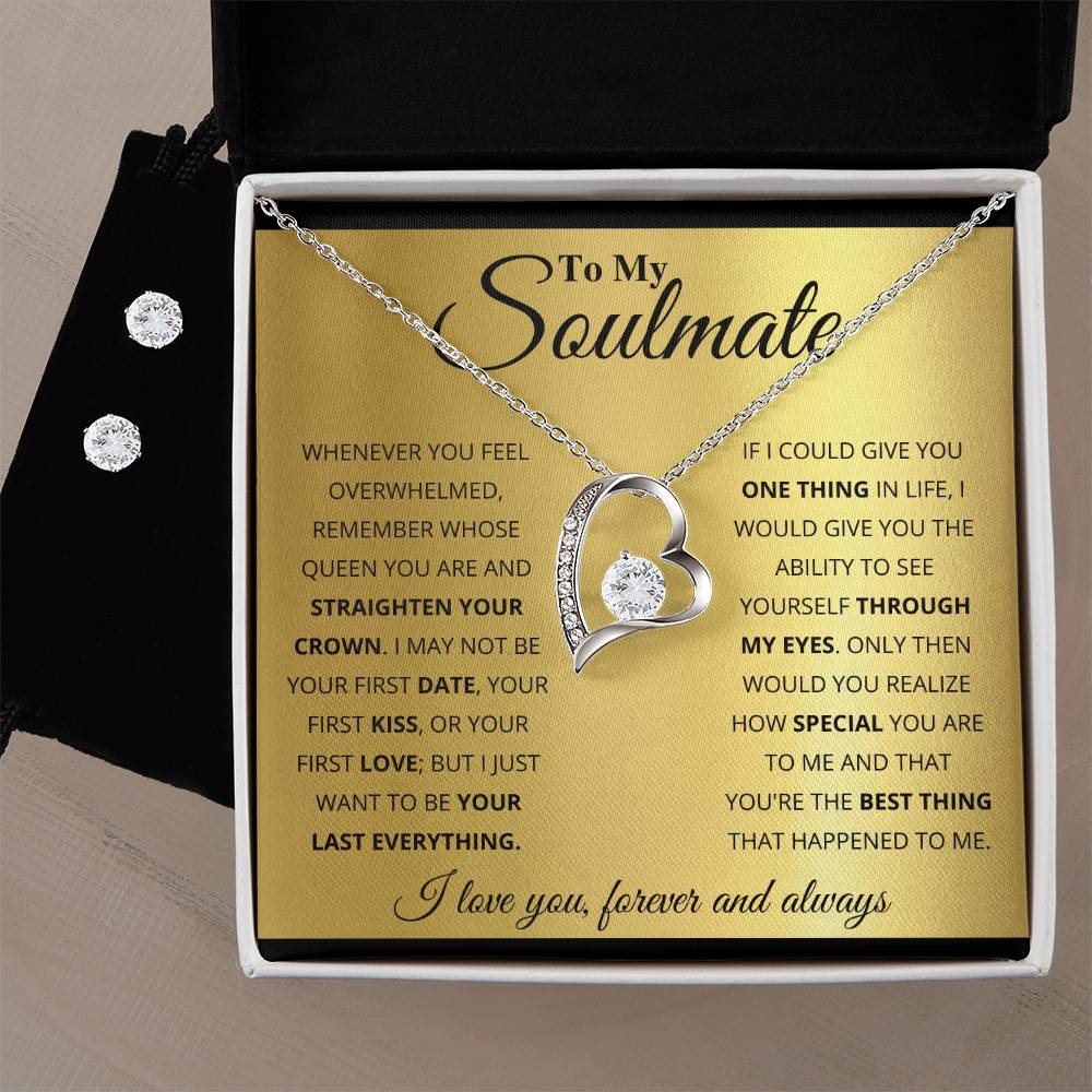 The "To My Soulmate, You're The Best Thing That Happened To Me - Forever Love Necklace" from ShineOn Fulfillment dazzles in an open black box. The lid displays a heartfelt message to a soulmate in elegant text on a golden background, perfectly complementing the 14k white gold finish of the heart-shaped necklace adorned with a gemstone.