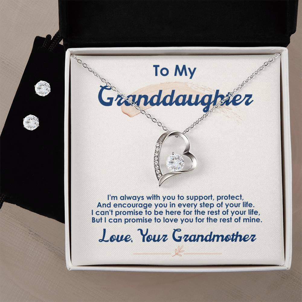 The "To My Granddaughter, I Love You For The Rest Of My Life - Forever Love Necklace" by ShineOn Fulfillment showcases a heart-shaped pendant in a radiant 14k white gold finish, adorned with a sparkling gemstone. Paired within the box are elegant Cubic Zirconia earrings, and it features an inscription that reads, "To My Granddaughter... Love, Your Grandmother.