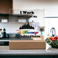 A decorative printed square acrylic plaque from ShineOn Fulfillment, titled "Disney Obsessed: Where Magic Meets Everyday Life!", sits on the kitchen counter. It features a castle silhouette and a vibrant Disney logo along with the phrase "I Work to Support My Disney Addiction." This bright space, complete with fresh produce nearby, is perfect for any Disney fan.
