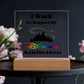 A Disney Obsessed: Where Magic Meets Everyday Life! acrylic plaque by ShineOn Fulfillment features a castle silhouette and vibrant "Disney" text, expressing the sentiment, "I Work To Support My Disney Addiction." This whimsical decor is beautifully enhanced by the soft blur of pink and white flowers in the background.
